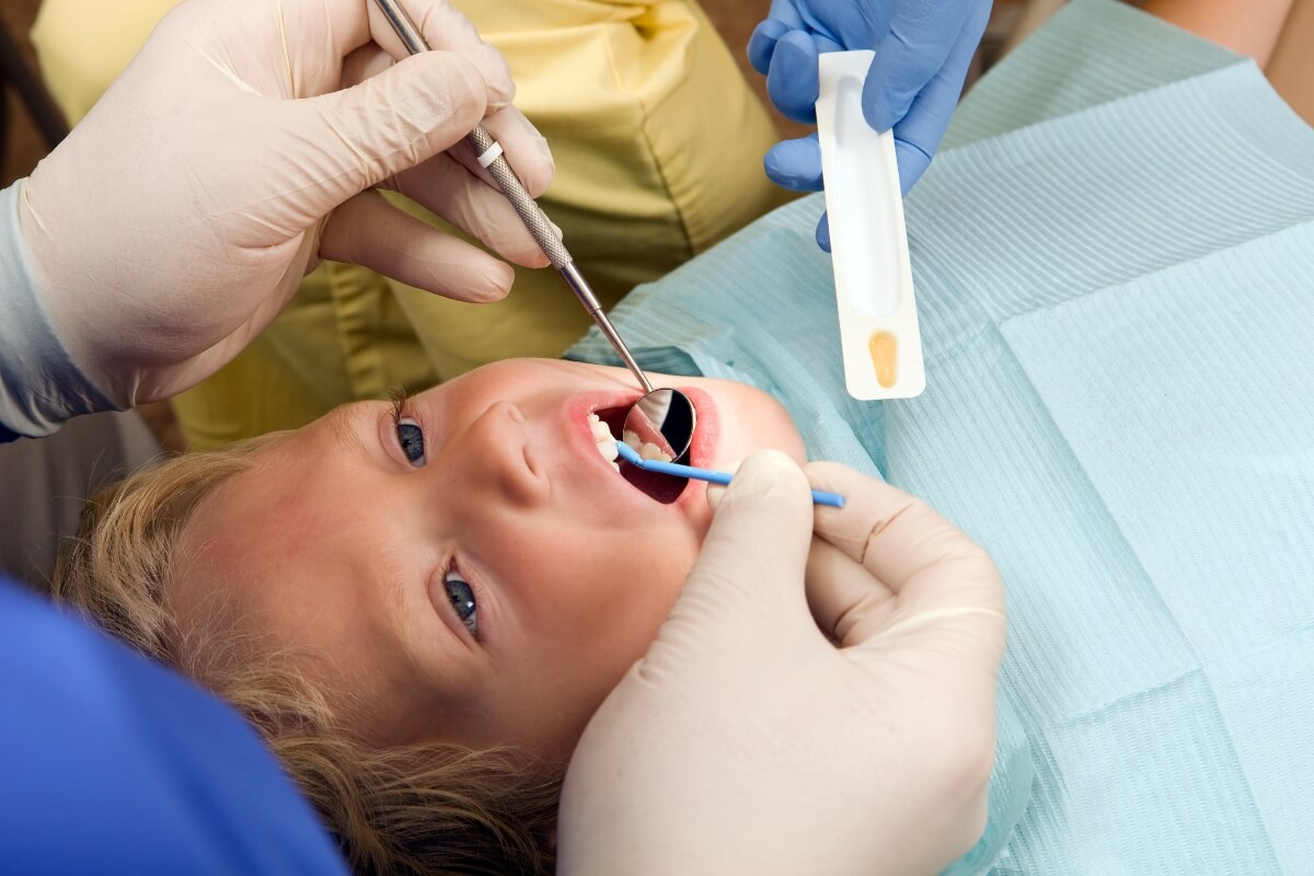 Child-Receiving-Fluoride-Treatment Child Receiving Fluoride Treatment