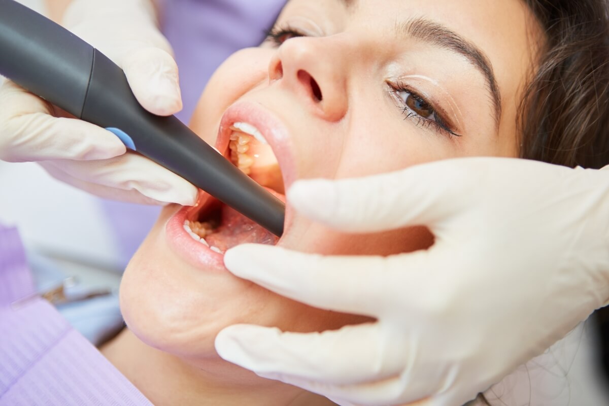 Women-Taking-Root-Canal-Treatment Women Taking Root Canal Treatment